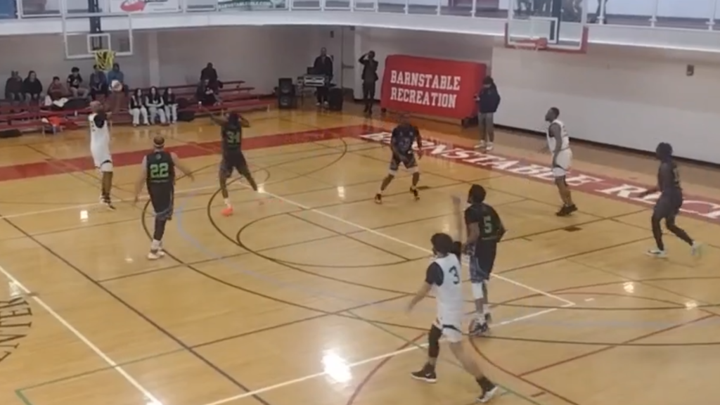 Aaron Strothers (#22) showcases his sharpshooting skills, nailing a crucial three-pointer for the Massachusetts Wolves in their intense matchup against 413 Elite